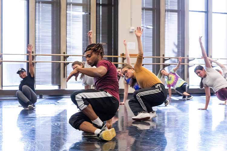 Students performing in studio space