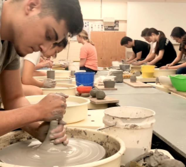 Students working on art in ceramics class