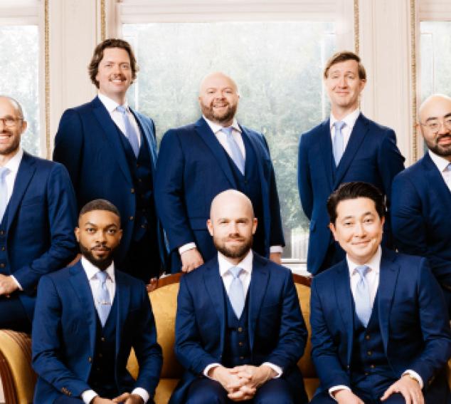 8 Cantus vocalists in blue suits