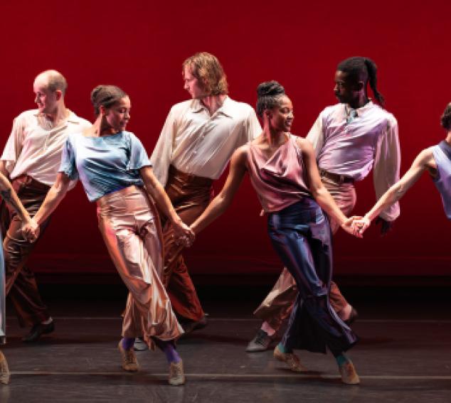 Mark Morris Dancers on stage against a red background